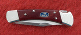 Buck 0110CWSNK 110 Folding Hunter Knife Chairman Series Chuck Buck Signature Cherrywood Dymondwood USA Lot#110-223