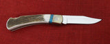 Buck 0110EKSLE1 110 Folding Hunter Knife 2009 WBC Elk Stag Turkey Feather Inlay NIB LOT#110-241