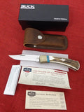 Buck 0110EKSLE1 110 Folding Hunter Knife 2009 WBC Elk Stag Turkey Feather Inlay NIB LOT#110-241