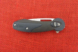 Buck 0766BKS 766 Revel SafeSpin Knife Black GRN Button Lock BU-575